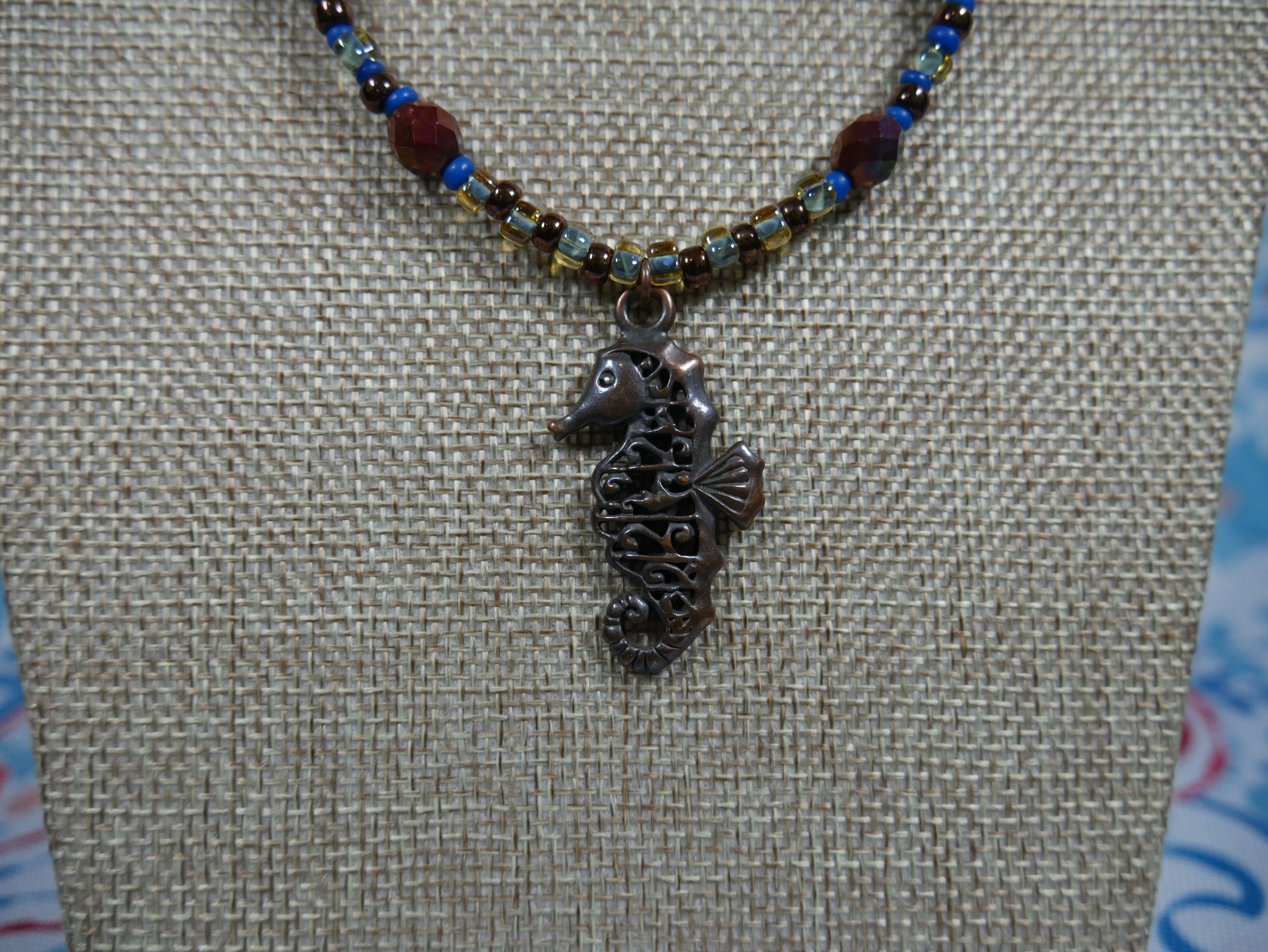 Bronze, Coppery, Brown and Blue Ocean-Themed Beaded Necklace with Tiger Eye and Seahorse Pendant